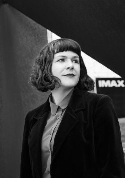 portrait of Jessica Mulgrove in front of an IMAX theatre