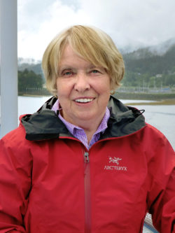 portrait of Josephine Mounsey in front of mountains