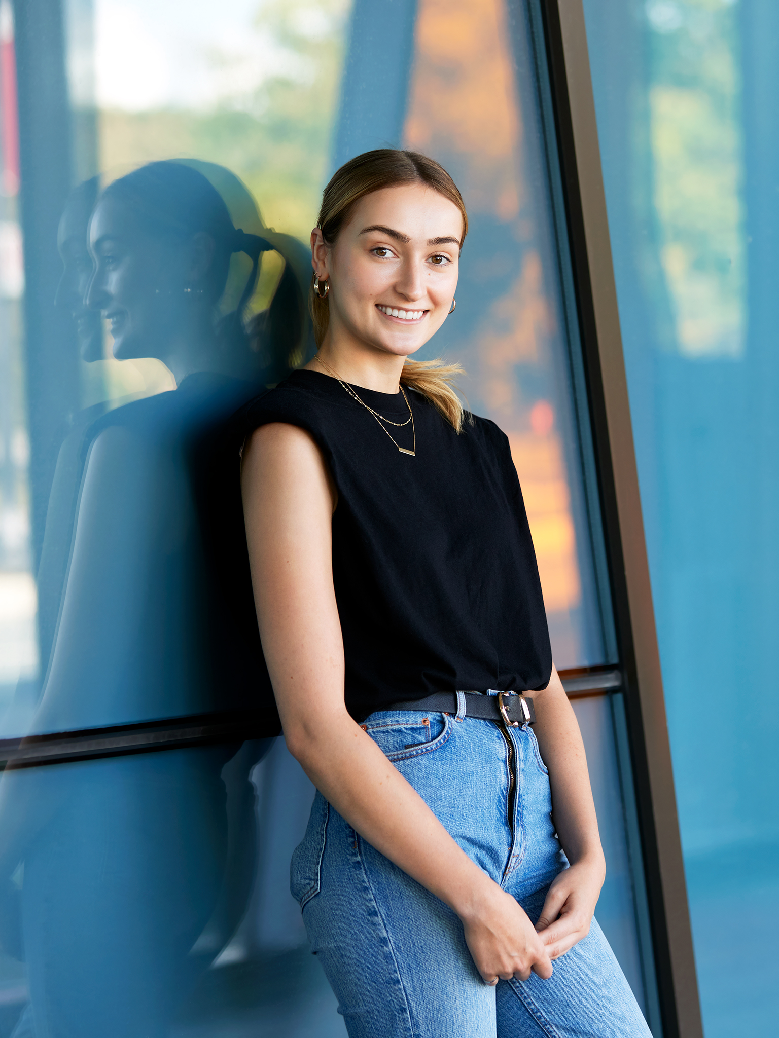 Image of woman, standing, smiling, at York University Accolade building