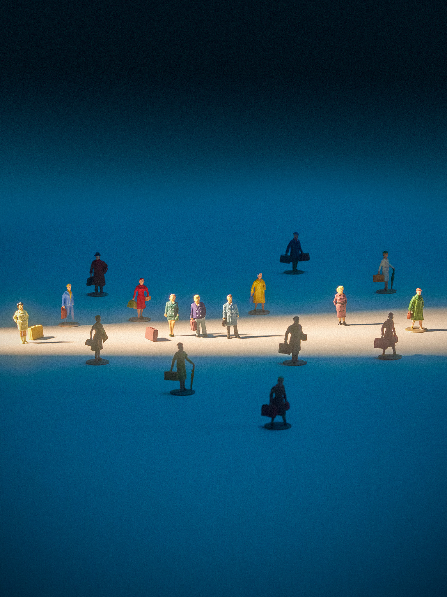 tiny figurines of travellers with luggage in a beam of light on a blue background 