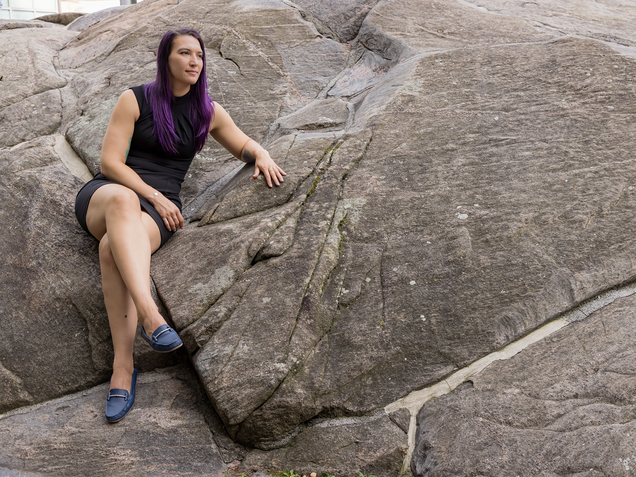 Josephine Morgenroth seated on large rocky area