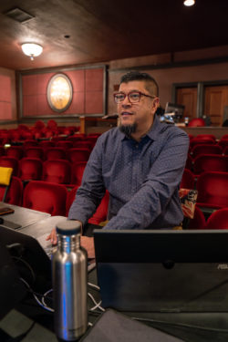 portrait of Arun Srinivasan at controls in theatre